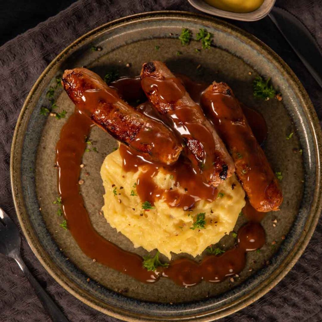 Three Aussie Farmers - Bangers and Cheesy Mash with Onion Gravy